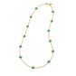 The Juliska Capucine De Wulf Berry Clover Double Sided Necklace features turquoise clover charms spaced along a delicate gold station chain, displayed in an oval on a white background.