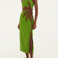 A person wears the Farm Rio Green Palm Tree Maxi Dress, featuring a brown leaf appliqué and side cutout, paired with flat sandals, standing against a plain background.