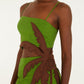 Woman wearing the Farm Rio Green Palm Tree Maxi Dress, a sleeveless tropical dress with thin straps and a palm tree detail, standing against a plain background.