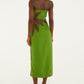 A person in a Farm Rio Green Palm Tree Maxi Dress with brown side leaf detail and flat sandals stands against a white background, facing away from the camera for a fresh, modern tropical look.