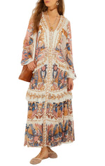 Woman wearing the Sea Garden Off White Braid Details Long Dress by Farm Rio, featuring a V-neck, long sleeves, and ruffled tiers. She accessorizes with a brown bag, sandals, and jewelry.