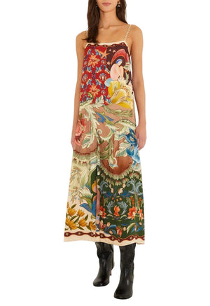 Farm Rio Lunar Boho Maxi Dress, a sleeveless, multicolored, patch-style botanical and celestial print dress worn with black boots.