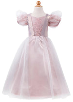 The Great Pretenders Platinum Princess Gown—a child-sized pink satin dress with sheer short puff sleeves, a floral lace bodice, and a layered tulle skirt—perfect for dress-up play—is displayed on a mannequin.