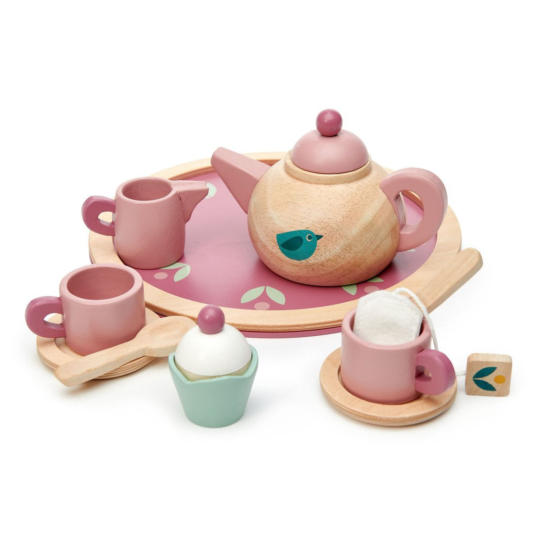 The Tenderleaf Birdie Tea Set by Tender Leaf Toys for children includes a tray, teapot, two teacups, a creamer, a sugar bowl, and a spoon. The set is decorated with pink accents and bird motifs.