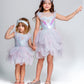 Two young girls stand hand in hand, wearing matching Tutu du Monde Girls’ Mermaid Magic Tutu Dresses with tulle skirts and sequin starfish headbands, posing against a plain light background.