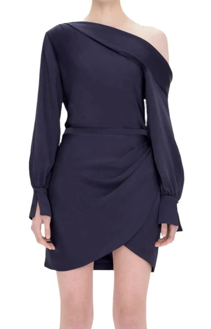 A person wearing a Simkhai Cameron One Shoulder Mini Dress featuring a stylish cold shoulder and long sleeve in dark blue.