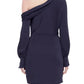 A person is wearing a dark blue Simkhai Cameron One Shoulder Mini Dress made of high sheen satin, viewed from the back.