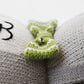 Close-up of two Cuddle + Kind Noah the Dog - Regular 20" plush toys with a green and white knitted bow between them; black letter "B" appears on the left one. #NoahBirthday.