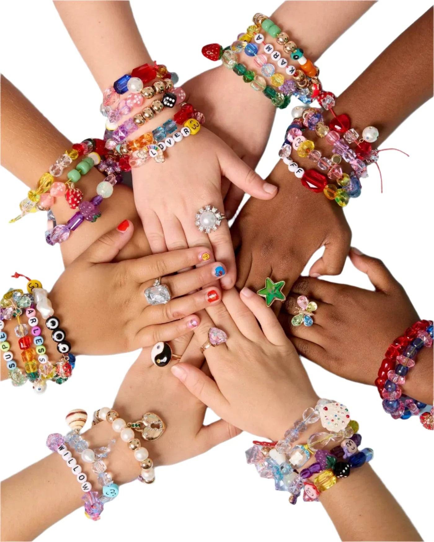 Several hands of different skin tones are grouped together, each adorned with vibrant beaded creations and sparkling rings, showcasing the creativity inspired by the Super Smalls Make It Super DIY Bead Kit from Super Smalls.
