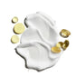 White cream, yellow liquid droplets, and yellow gel capsules—each representing Jack Black’s Cool Moisture Body Lotion—are artfully spread on a white background, evoking a fresh sensation that cools and soothes the skin.
