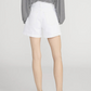 A person stands facing away, wearing a black and white striped top, The Everyday Short by Frame (pure cotton, high-rise, 4" inseam), and black heeled sandals.