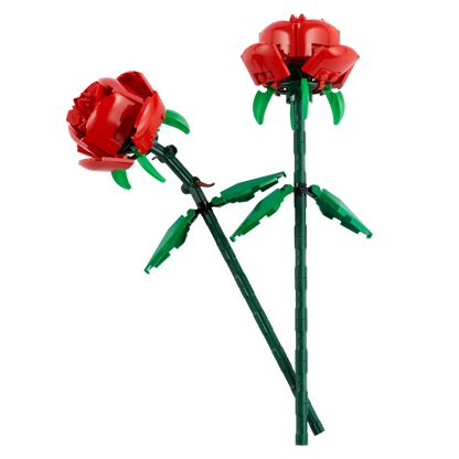 Two LEGO® Roses from Legos - Toyhouse, featuring red petals and green stems/leaves, arranged on a transparent background—ideal for Valentine's Day.