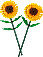 The LEGO® Sunflowers by Legos - Toyhouse offer a vibrant display with two plastic sunflowers featuring yellow petals, brown centers, and lush green stems and leaves. These cheerful blooms evoke the playful nature of a LEGO building kit, adding warmth to any setting.