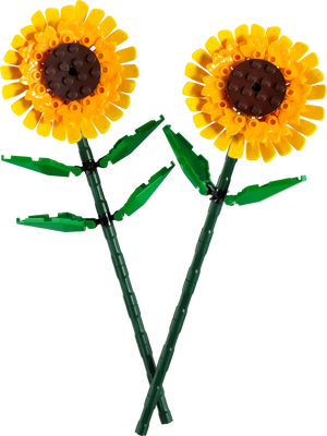 The LEGO® Sunflowers by Legos - Toyhouse offer a vibrant display with two plastic sunflowers featuring yellow petals, brown centers, and lush green stems and leaves. These cheerful blooms evoke the playful nature of a LEGO building kit, adding warmth to any setting.