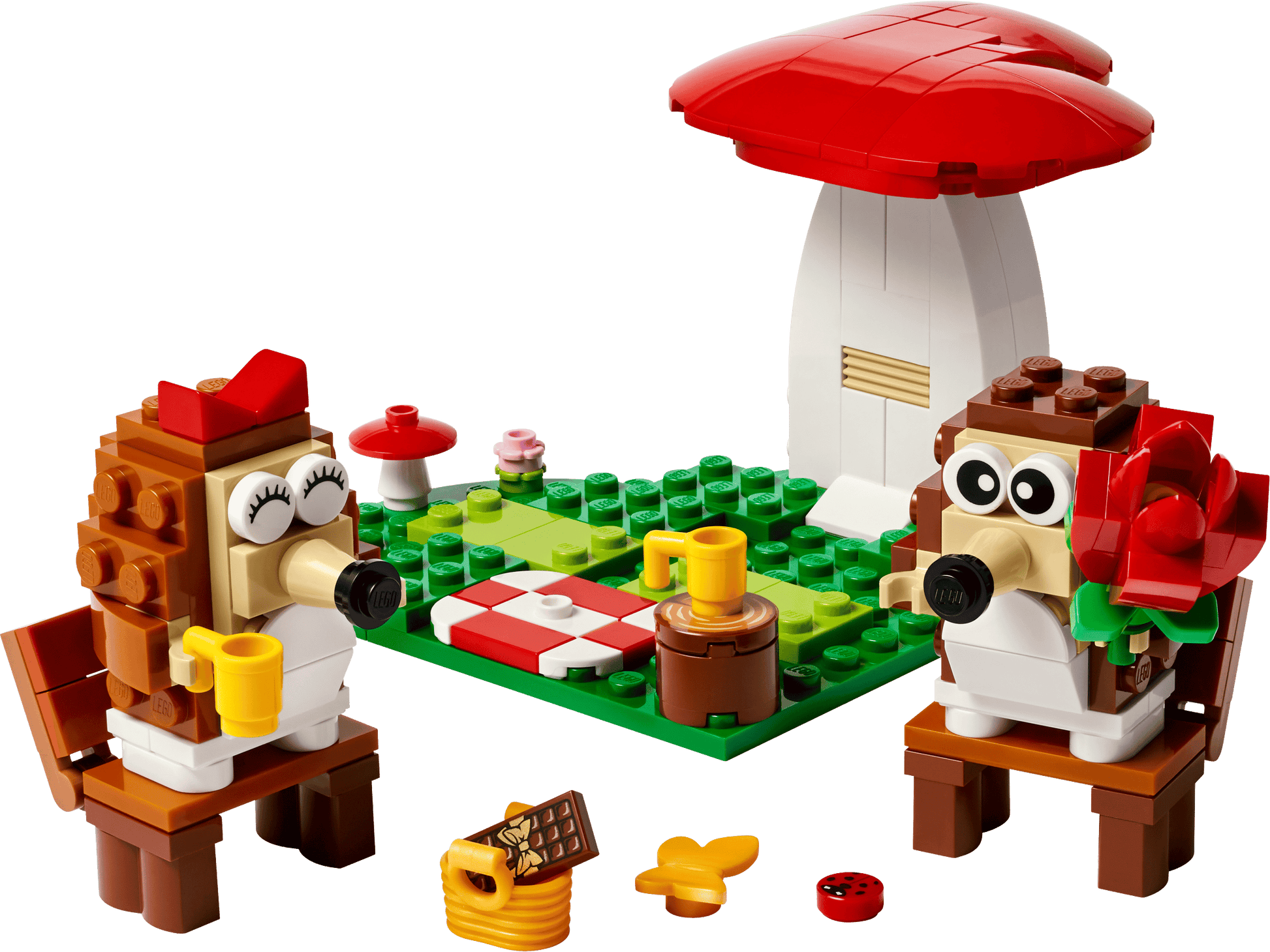 Two hedgehog LEGO figures enjoy a picnic with cups, food, and a large mushroom in the LEGO® Hedgehog Picnic Date set by Legos - Toyhouse—the perfect animal toy build or playful gift for fans of whimsical scenes.