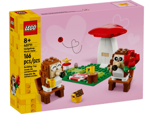 The LEGO® Hedgehog Picnic Date box by Legos - Toyhouse includes 166 pieces to build two hedgehogs, a mushroom, picnic accessories, and a heart backdrop—a charming animal toy set and unique gift for all ages.