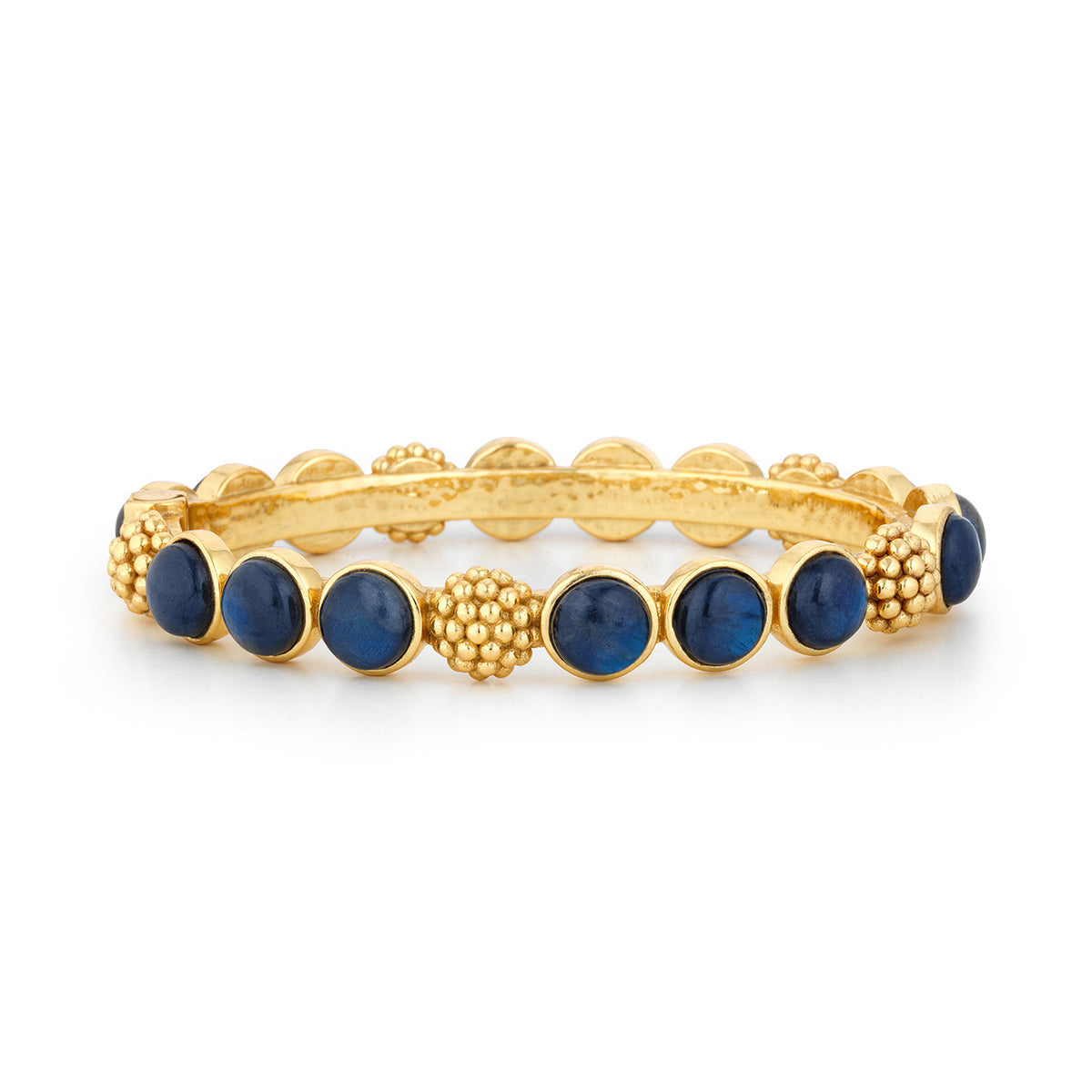 The Juliska Capucine De Wulf Berry Gem Hinged Bangle features alternating round blue gem drops and textured golden berry clusters, all set against a white background.