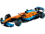 The LEGO® Technic™ McLaren Formula 1™ Race Car by Legos - Toyhouse features an orange, blue, and black design with intricate aerodynamic elements and branding decals, embodying speed and precision.