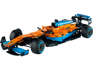 The LEGO® Technic™ McLaren Formula 1™ Race Car by Legos - Toyhouse features an orange, blue, and black design with intricate aerodynamic elements and branding decals, embodying speed and precision.