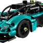The LEGO® Technic™ Aston Martin Valkyrie by Legos - Toyhouse is a teal and black model kit featuring detailed bodywork, large wheels, a V12 engine, and exposed mechanical elements.