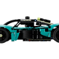 Side view of a teal and black LEGO® Technic™ Aston Martin Valkyrie by Legos - Toyhouse, featuring visible wheels, detailed cockpit, aerodynamic design, and an impressive V12 engine.