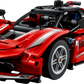 The LEGO® Technic™ Ferrari FXX K by Legos - Toyhouse features red color, white stripes, a detailed engine, and racing stickers—seen from a front-side angle. It’s ideal for kids and collectors who love model cars.