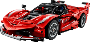 The LEGO® Technic™ Ferrari FXX K by Legos - Toyhouse features red color, white stripes, a detailed engine, and racing stickers—seen from a front-side angle. It’s ideal for kids and collectors who love model cars.
