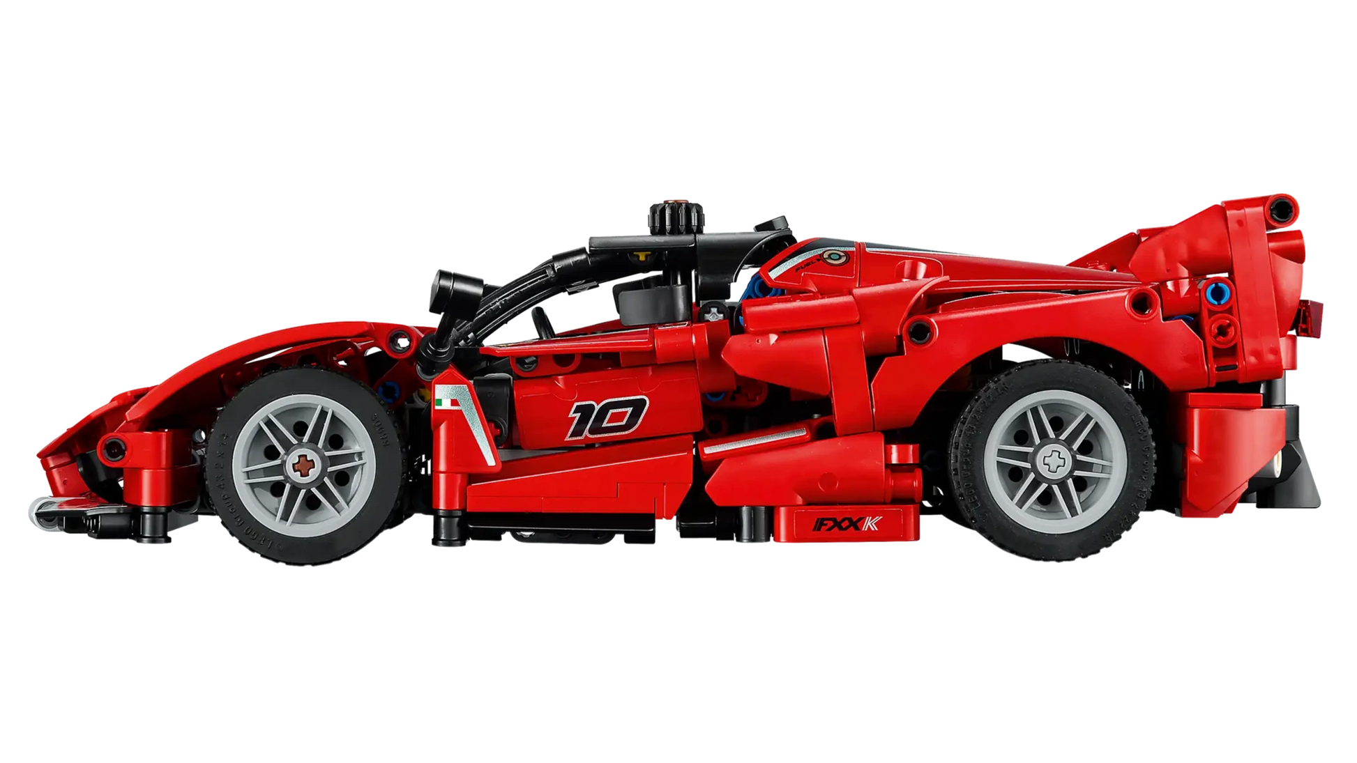 The LEGO® Technic™ Ferrari FXX K by Legos - Toyhouse features a red race car with black and gray details and number 10 on the side—ideal as a toy for kids or a collector's model car kit.