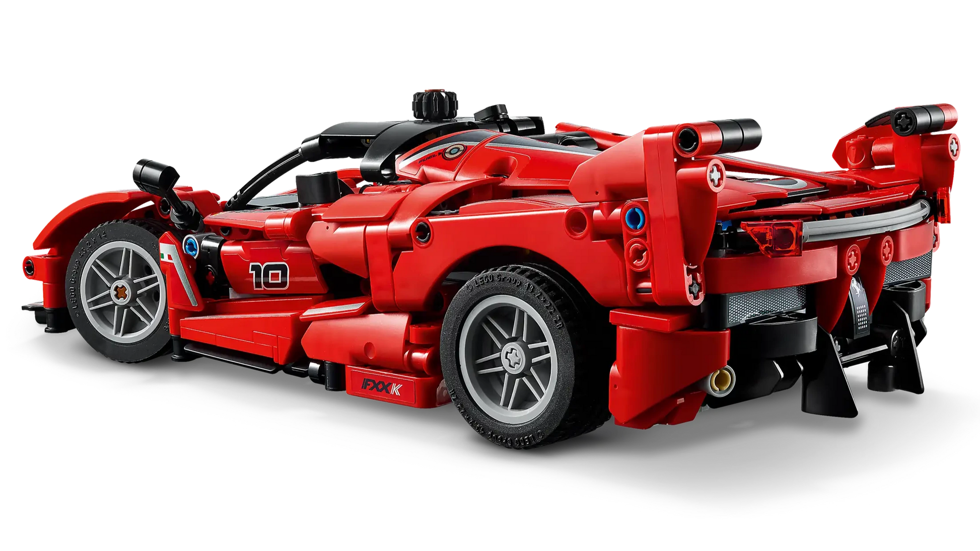 The Legos - Toyhouse LEGO® Technic™ Ferrari FXX K model kit in red features detailed rear spoilers, side mirrors, and realistic tires, shown from the back left.