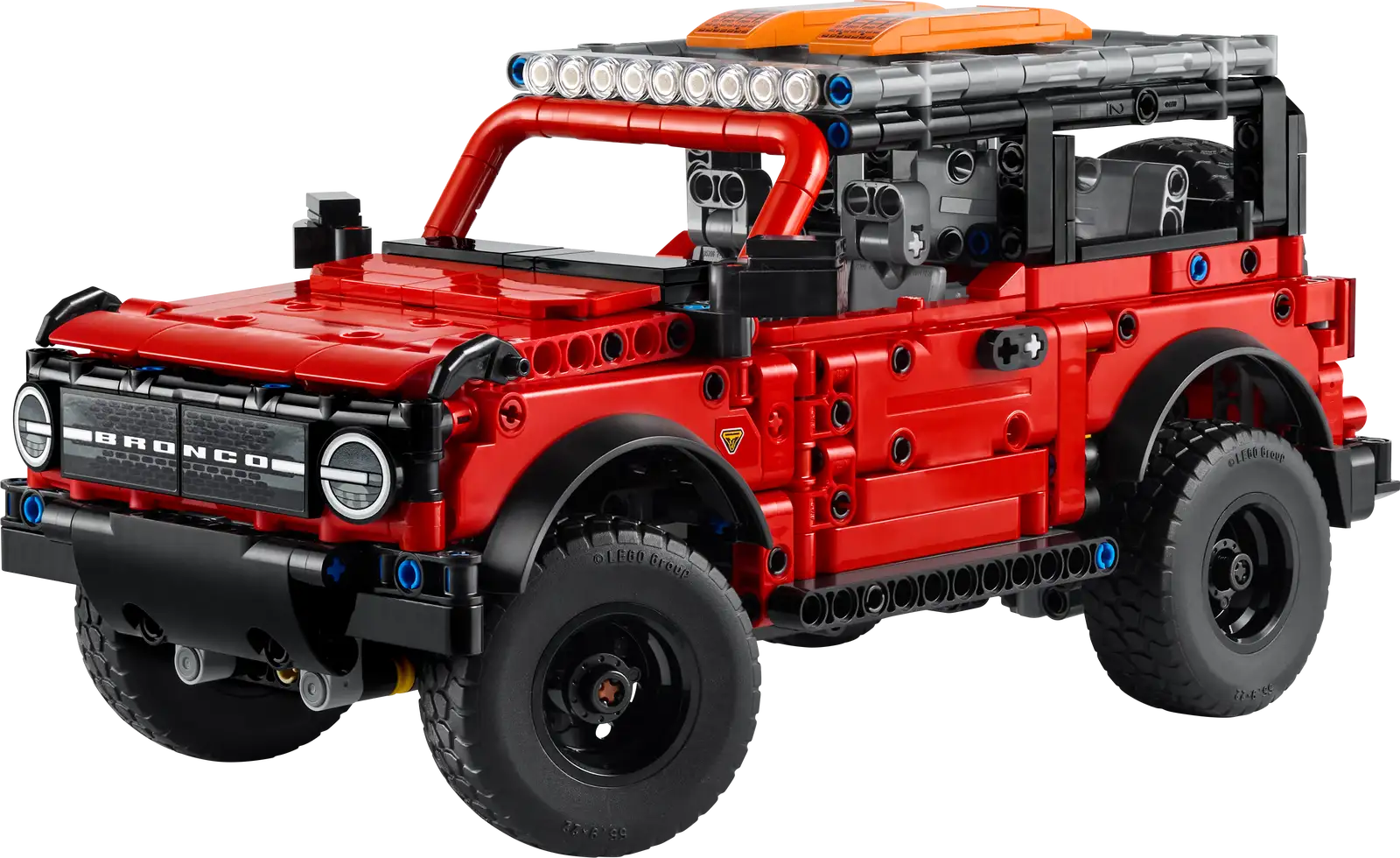The LEGO® Technic™ Ford Bronco® SUV by Legos - Toyhouse features a red exterior, black wheels, roof lights, and detailed design—ideal as a STEM building toy for enthusiasts.