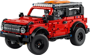 The LEGO® Technic™ Ford Bronco® SUV by Legos - Toyhouse features a red exterior, black wheels, roof lights, and detailed design—ideal as a STEM building toy for enthusiasts.
