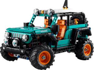 The LEGO® Technic™ Jeep® Wrangler Rubicon SUV by Legos - Toyhouse features teal and orange parts, large off-road tires, and working front and roof lights—ideal for engineering toy enthusiasts.