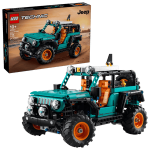 The LEGO® Technic™ Jeep® Wrangler Rubicon SUV by Legos - Toyhouse is shown fully assembled before its box, with 723 pieces and recommended for ages 10+, making it ideal for engineering toy fans.