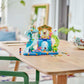The Legos - Toyhouse LEGO® Friends Heartlake City Water Park playset, complete with slides and mini-figures, is assembled on a wooden table in a bright room—an ideal role-playing toy for kids.