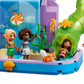 Four mini-doll figures enjoy aquatic fun in the LEGO® Friends Heartlake City Water Park by Legos - Toyhouse, with sea décor, a green tube slide, and a starfish window backdrop—perfect for creative kids’ imaginative play.
