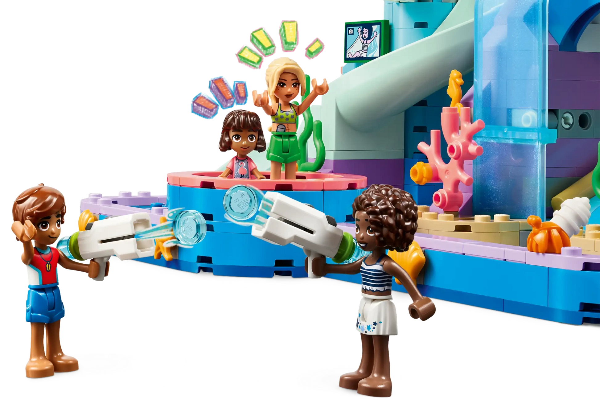 Four mini-dolls enjoy the LEGO® Friends Heartlake City Water Park by Legos - Toyhouse, with two using water blasters and two on a raised platform surrounded by colorful blocks—perfect for imaginative play adventures.