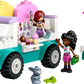 The LEGO® Friends Heartlake City Ice Cream Truck by Legos - Toyhouse includes two girl figurines, a rabbit, outdoor table with chairs and umbrella, plus ice cream accessories for creative pretend play.