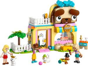 The LEGO® Friends Pet Accessories Shop by Legos - Toyhouse features a dog-shaped building, three figures, a dog, two cats, plus animal-care accessories and colorful decorations for imaginative pretend play.