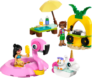 Two LEGO Friends figures enjoy the Legos - Toyhouse LEGO® Friends Unicorn & Flamingo Pool Party set, featuring a beach scene, flamingo float, pineapple-shaped DJ booth, drinks bench, and a small white animal on a unicorn pool float.
