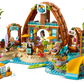 Bring the LEGO® Friends Family Vacation Beach Resort by Legos - Toyhouse to life with a beach café, yellow slide, palm trees, surfboards, mini-figures, a dolphin, and fun accessories for seaside adventures.