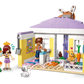 The LEGO® Friends Heartlake City Bunny Hotel by Legos - Toyhouse includes a small house, two figures, a dog, a rabbit, a carrot, and accessories—an ideal animal care toy and perfect gift for imaginative kids.