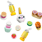 Colorful toy food items and accessories from the LEGO® Friends Unicorn Dream Café by Legos - Toyhouse, including donuts, pie, cupcake, citrus slices, a strawberry, and a unicorn figure, arranged on a white background.