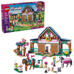 The LEGO® Friends Horse Stable and Riding Academy by Legos - Toyhouse includes a detailed stable, horse toys, three mini-figures, and fun accessories—ideal for riding academy fans; product box shown in the background.
