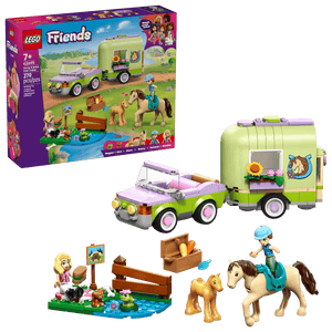 The LEGO® Friends Horse & Baby Foal Trailer by Legos - Toyhouse includes a green and purple car, two horse figures, two mini-dolls, and accessories—ideal for horse lovers; packaging shown in the background.