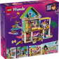 The LEGO® Friends Beach House with Seals by Legos - Toyhouse features a vibrant two-story playhouse, five figures, and accessories, all highlighted with illustrated details on a purple background.