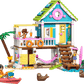The Legos - Toyhouse LEGO® Friends Beach House with Seals set includes two mini-figures, a kayak, surfboards, seals, beach accessories, and features a sandy base with palm tree and outdoor stairs.