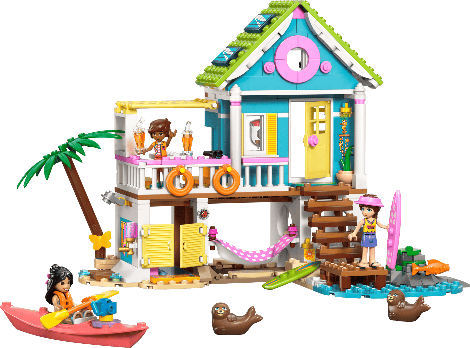 The Legos - Toyhouse LEGO® Friends Beach House with Seals set includes two mini-figures, a kayak, surfboards, seals, beach accessories, and features a sandy base with palm tree and outdoor stairs.