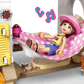 A LEGO® Friends Beach House with Seals by Legos - Toyhouse features figures relaxing on a pink polka-dot hammock with music notes, accessories, and seals—creating a cozy scene perfect for any playhouse set for kids.