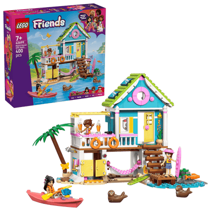 The Legos - Toyhouse LEGO® Friends Beach House with Seals set features a two-story beach house, kayak, animal figures, and 400 pieces; perfect for ages 7+, with packaging depicting a lively seaside scene.