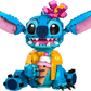The LEGO® Disney™ Stitch by Legos - Toyhouse features a blue and pink Stitch with a yellow shirt, flower crown, and pink ice cream cone—a cute buildable set that's the perfect Disney gift.